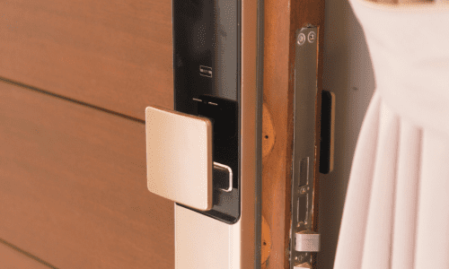 Smart digital lock installed on wooden front door