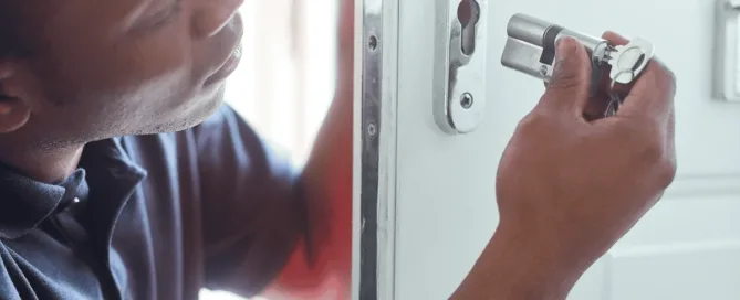 locksmith changing the rental door lock